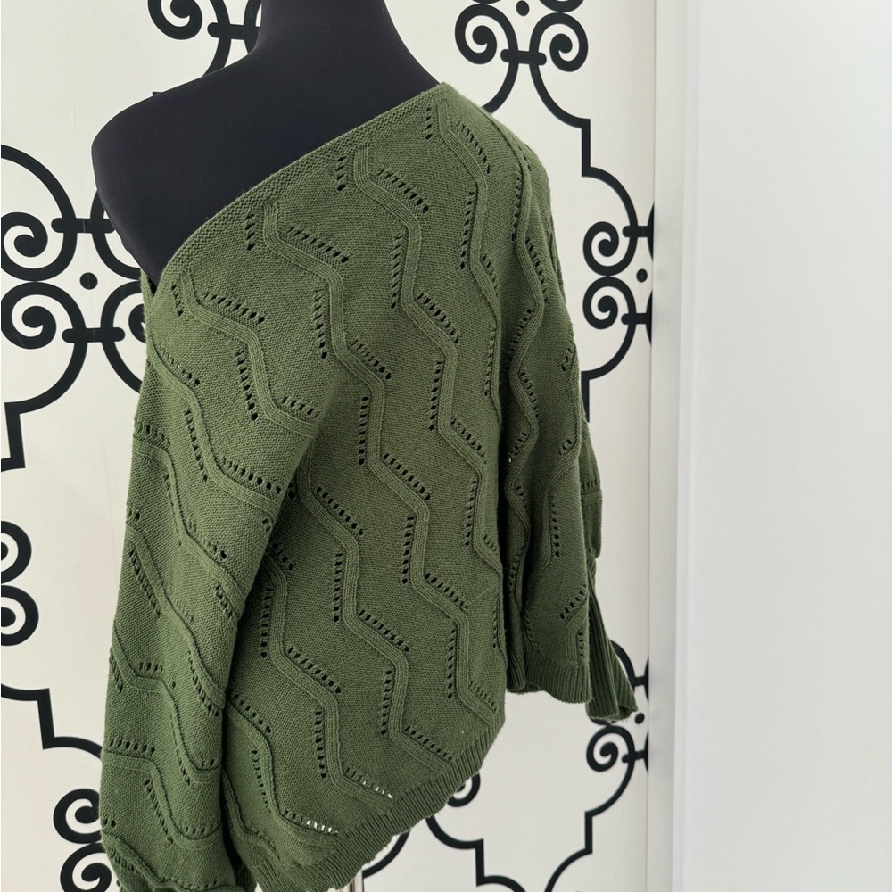Off the shoulder army green knit sweater.